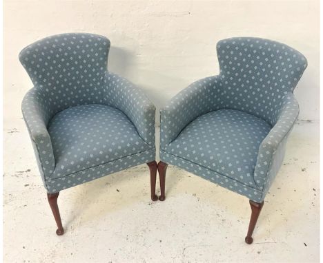 PAIR OF ARMCHAIRSwith shaped backs and seats, covered in a light blue material with white motifs, standing on cabriole front 
