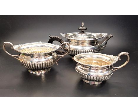 VICTORIAN THREE PIECE SILVER TEA SERVICEcomprising tea pot, two handled sugar basin and milk jug, all with gadrooned decorati
