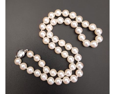 PEARL NECKLACEwith individually knotted pearls and diamond set eighteen carat white gold clasp, 47cm long 