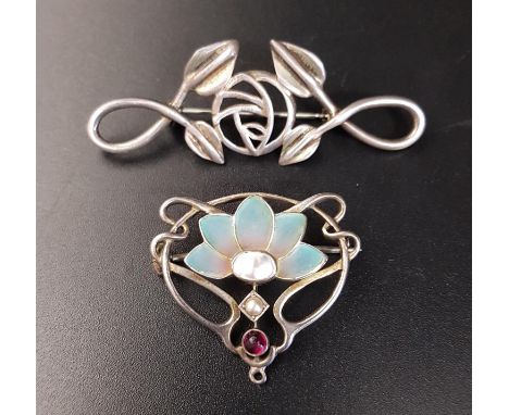 TWO ART NOUVEAU STYLE SILVER BROOCHESone set with enamel, mother of pearl, seed pearl and red gemstone within a scroll and pi