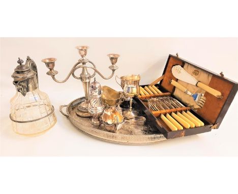 SELECTION OF SILVER PLATED WARESincluding an engraved oval tray with pierced decoration, three branch candelabra, claret jug,