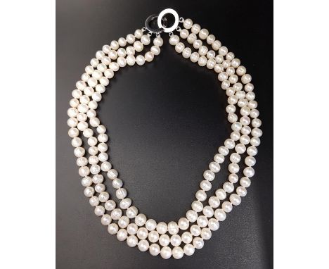 TRIPLE STRAND PEARL NECKLACEapproximately 35cm long 