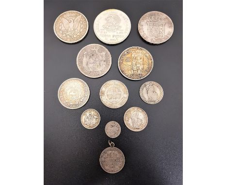 SELECTION OF WORLD SILVER COINSthe silver content ranging from .925 to .720, including an 1894 South Africa 2 1/2 shillings; 