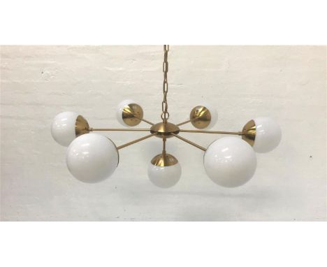 SIX BRANCH PENDANT LIGHTwith opaque circular glass shades and brass effect suspension chain, and with additional lower drop p