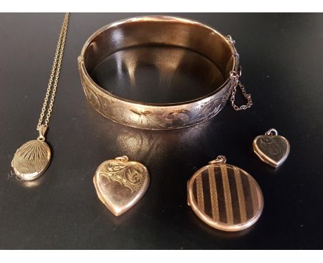 SELECTION OF GOLD PLATED JEWELLERYcomprising a hinged bangle with engraved scroll decoration, two heart shaped locket pendant