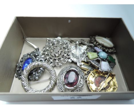A selection of white metal brooches including Celtic style and marcasite