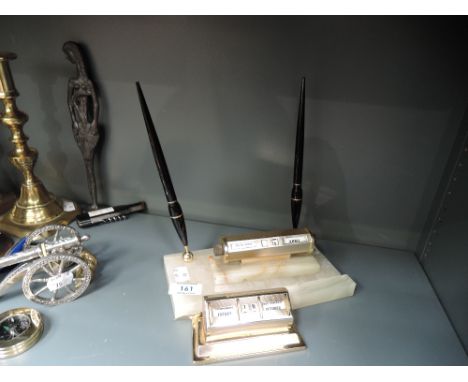 A selection of desk top office items including onyx perpetual calendar pen and opener set Pat no. 253845 and another similar 