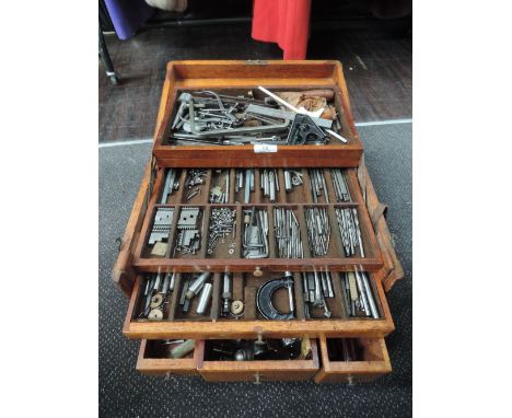 An engineers, tinkers or machinist tool chest with oak body, compartmental draws, fold out work station brass fitments and ca