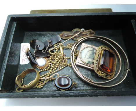 A vintage green box containing a small selection of yellow metal and rolled gold jewellery including bangles, ring agate lock