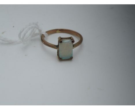 A lady's dress ring having a square opal stone in a four claw mount on a rolled gold loop, size PStone looks ok, loo no marks