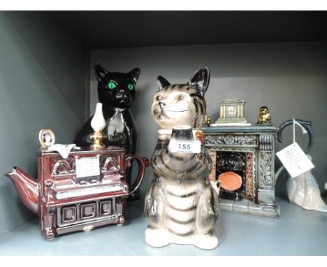 A selection of unusual figural and collectable teapots including Paul Cardew and life size ceramic cat figure 