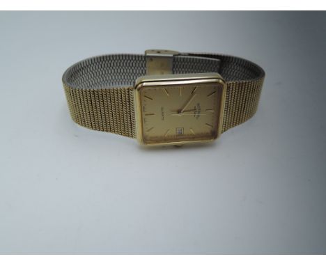 A gents gold plated Rotary wrist watch having baton numerals to rectangular face on woven strapWe do not test for functionall