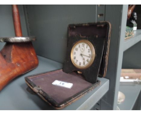A Swiss made 8 day movement travel clock or watch with brass bodyCONDITION REPORT - NOT RUNNING 