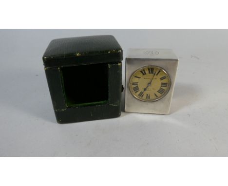 A Leather Cased Miniature Silver Travel Clock In Working Order the Dial Inscribed Kendal and Co. Paris, 6.25cm High 