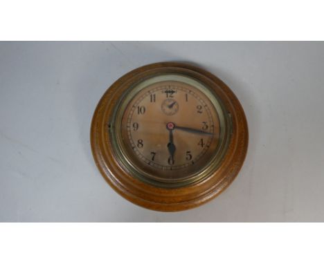 A Circular Oak Framed Wall Clock with Copper Dial, 26cm Diameter