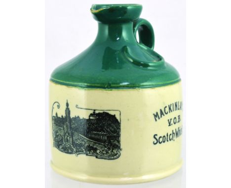 MACKINLAYS WHISKY JUG. (WG pg 119) 6.25ins tall, green top lower off white glaze. Black transfer Edinburgh Castle & Scotts Mo