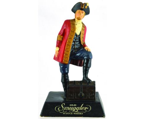 OLD SMUGGLER SCOTCH WHISKY ADVERTISING FIGURE. 11.5ins tall. Naturalistically coloured rubberoid statuette of sailor with one