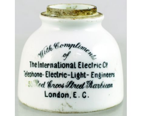 INSULATOR. 2.25ins tall, white glaze, black transfer WITH COMPLIMENTS/ OF/ THE INTERNATIONAL ELECTRIS CO/ TELEPHONE-ELECTRIC-
