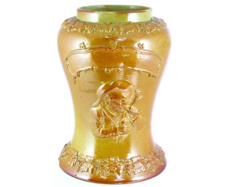 TOBACCO/ SNUFF JAR. 10ins tall, tan salt glaze waisted form jar. Sprigged gent smoking pipe holding snuff box, elaborate scro