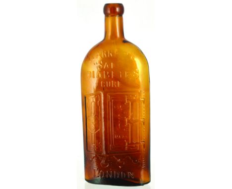 WARNERS SAFE CURE BOTTLE. 9.5ins tall, deep amber glass. Embossed WARNERS/ SAFE/ DIABETES/ CURE/ LONDON with the familiar saf
