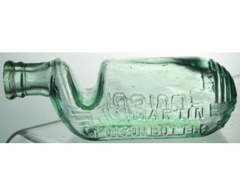DR MARTINS POISON BOTTLE. (DP pg 29 & 82) 5.25ins long, light bluey aqua glass, u-bend shape bottle. Embossed THE MARTIN/ POI