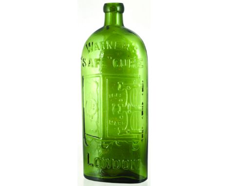 WARNERS SAFE CURE BOTTLE. 9.25ins tall, light olive green glass. Embossed WARNERS/ SAFE CURE/ LONDON with the familiar safe m