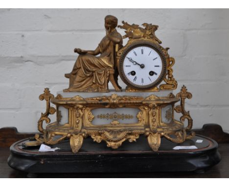 19th Century French gilt spelter mantel clock, with a figured surmount and alabaster panels, circular enamel dial with Roman 