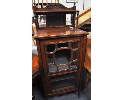 Victorian walnut music cabinet, shelf over with carved panels, single door with part glazed part mirror panels, width 56cms