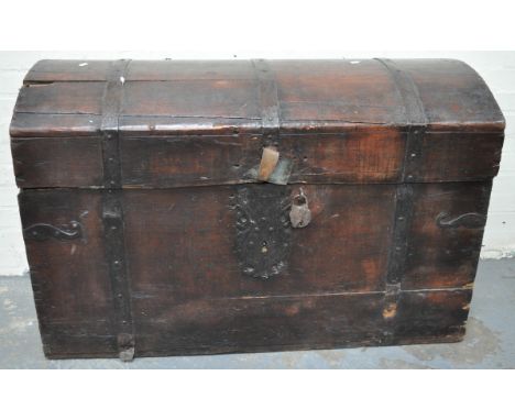A Continental stained pine domed top trunk.