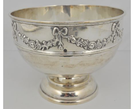 Silver pedestal bowl, circular form, applied floral wreath border with ribbon ties, moulded girdle, circular foot, Walker & H