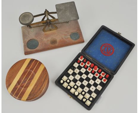 Set of postal scales and weights, turned and inlaid wooden travel chess set and other boxed pair of binoculars, 7 x 20 cased,