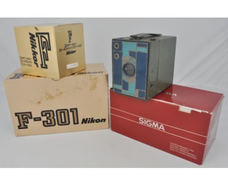 Box of camera equipment, Nikon body and lenses, and a Kodak Box Brownie