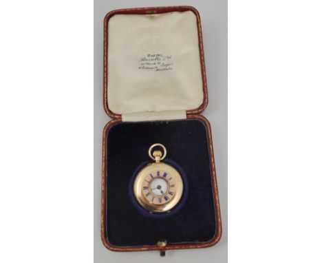 Ladies 12ct gold fob watch, part closed face with enamel numerals, white enamel dial.