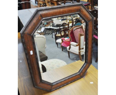 An oak framed wall mirror.