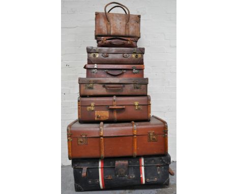 Suitcases: Four leather suitcases, two wooden cloth trunks, one leather carrier; and one large trunk (8)