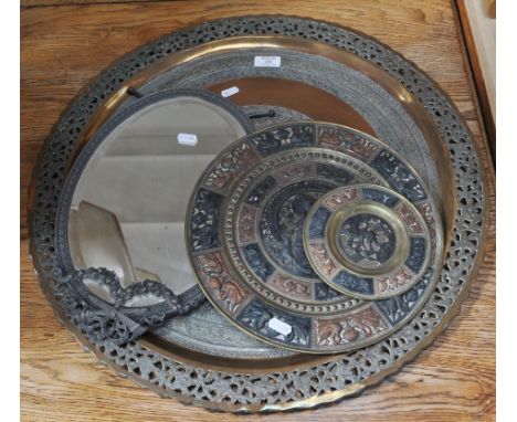 Persian copper and silvered charger and two Indian circular plaques and metal framed mirror, (4).