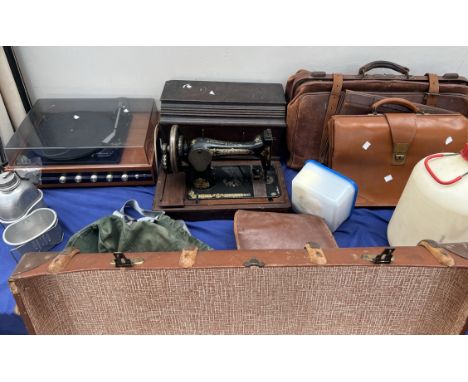 A Singer sewing machine together with a record player, leather bags, trunks, projector screens etc 