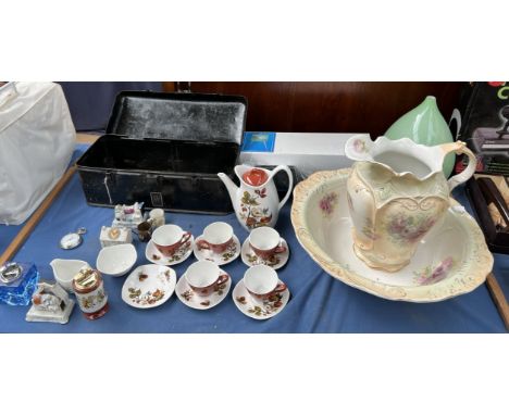 A tin box with Rolls Royce transfer together with a jug and basin set, part coffee set, crested wares, easel, glass vase 