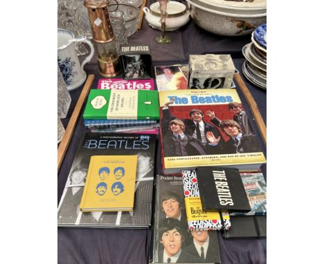 The Bootleg Beatles yearly book together with books on the Beatles, mugs,miner's lamp etc 