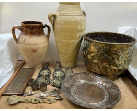 A large brass log basket embossed with fruit, leaves and gadrooning together with horse brasses, cribbage board, pottery twin