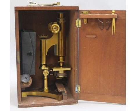 An R & J Beck monocular microscope with accessories, cased