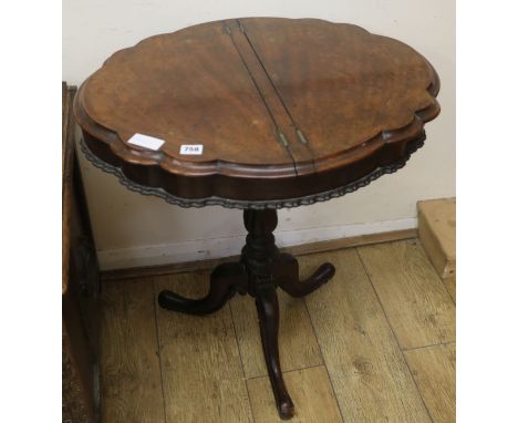 A Victorian walnut tripod base work table, W.66cm