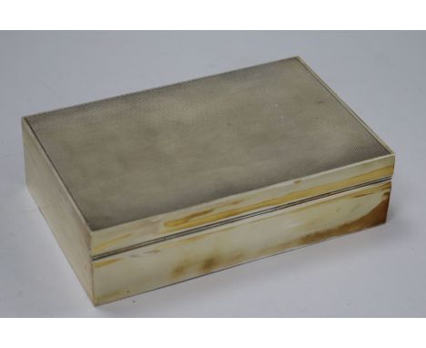 An early 1950's Asprey & Co engine turned silver rectangular cigarette box, 14cm.