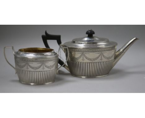 A Victorian silver swag-engraved teapot and matched sugar bowl, London 1884-5, makers Holland, Son & Slater, gross 19oz
