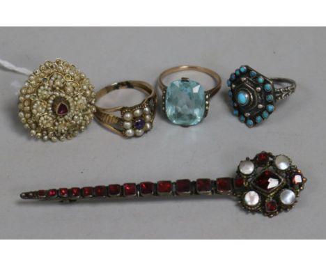 A 19th century yellow metal, pearl and amethyst ring, a seed pearl and ruby panel ring (made up) and three other items, inclu