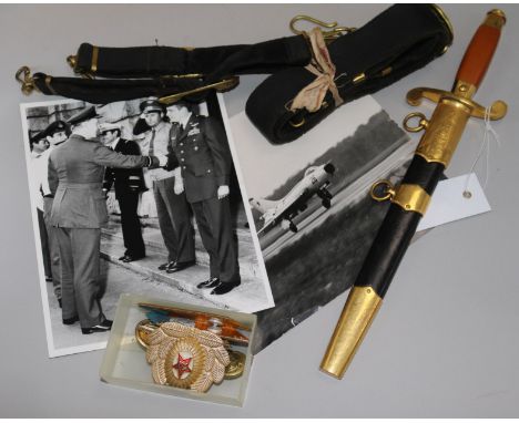 A 20th century Russian Army dagger, Naval belt, badges and insignia including photos etc