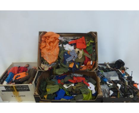 Four boxes of Action Man figures, accessories and clothing.