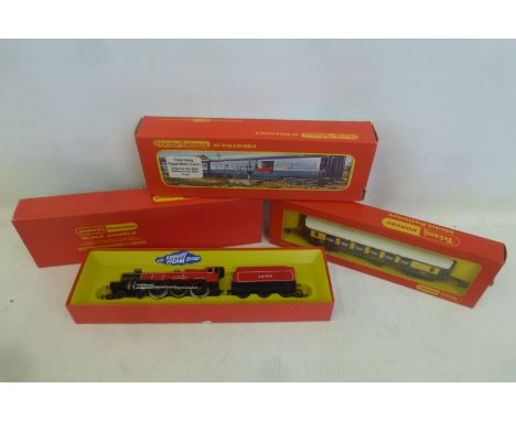A boxed Hornby Railways OO gauge locomotive 'The Lord Westwood', R.7654-6-0, a boxed operating mail coach set and a boxed Pul