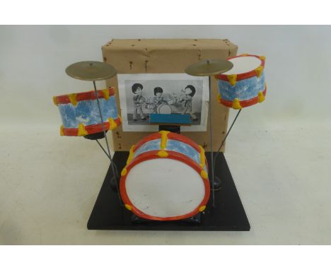 A Pelham Puppet drum kit in original box. 