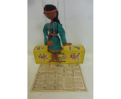 A boxed Pelham Puppet Native American Squaw, with original beads and felt embellished dress. 